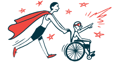 A person wearing a superhero cape pushes a child in a wheelchair.