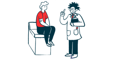 A doctor holding a clipboard gestures to a patient, who is seated on an examining table.